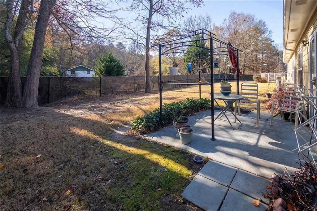 2545 Rosehill Circle Lithia Springs, GA 30122 - Photo 27 of 27 a view of a backyard with sitting area