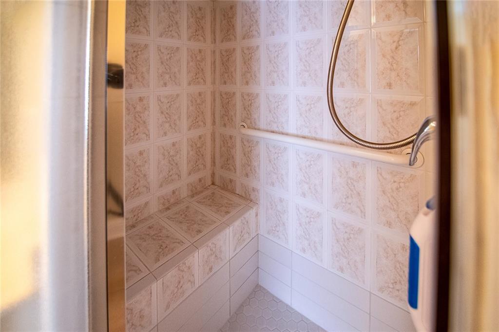 2545 Rosehill Circle Lithia Springs, GA 30122 - Photo 4 of 27 a bathroom with a granite countertop shower and a sink