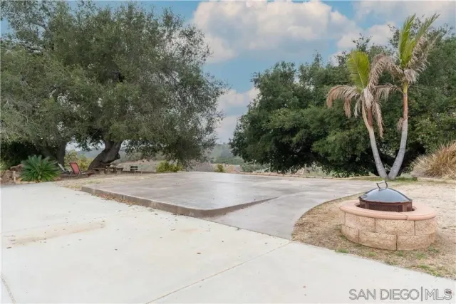 a view of a backyard of the house