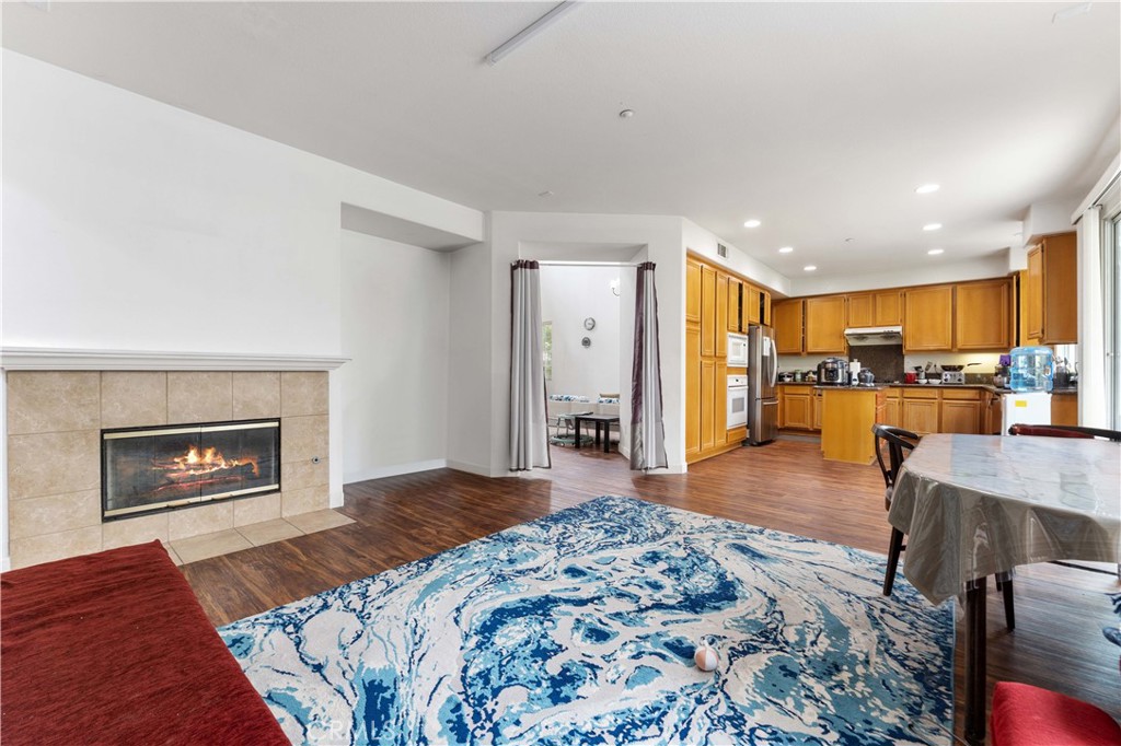 11390 Parkfield Court Riverside, CA 92505 - Photo 12 of 42 a spacious bedroom with a bed and a flat screen tv