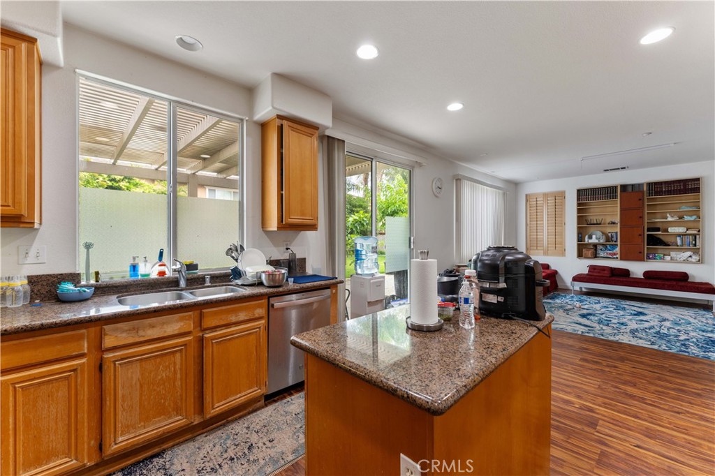 11390 Parkfield Court Riverside, CA 92505 - Photo 15 of 42 a kitchen with sink a counter top space and living room