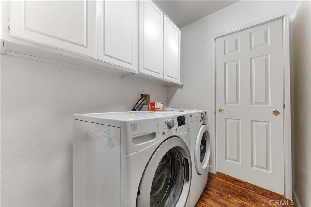11390 Parkfield Court Riverside, CA 92505 - Photo 19 of 42 a view of storage and utility room with washer and dryer