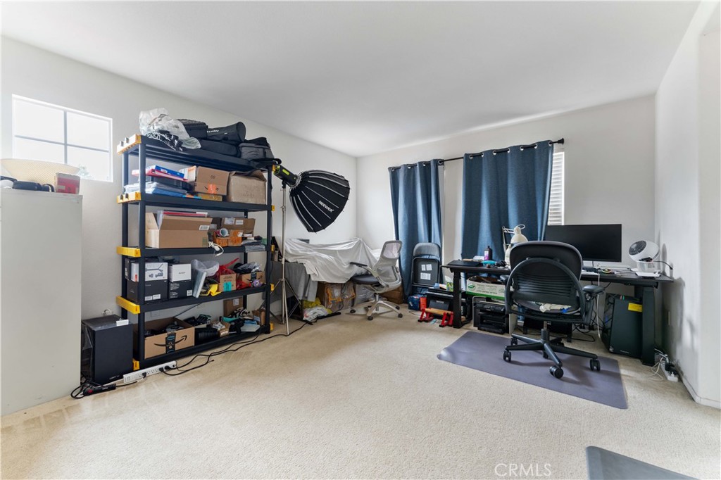 11390 Parkfield Court Riverside, CA 92505 - Photo 20 of 42 a view of a workspace with furniture and gym equipment