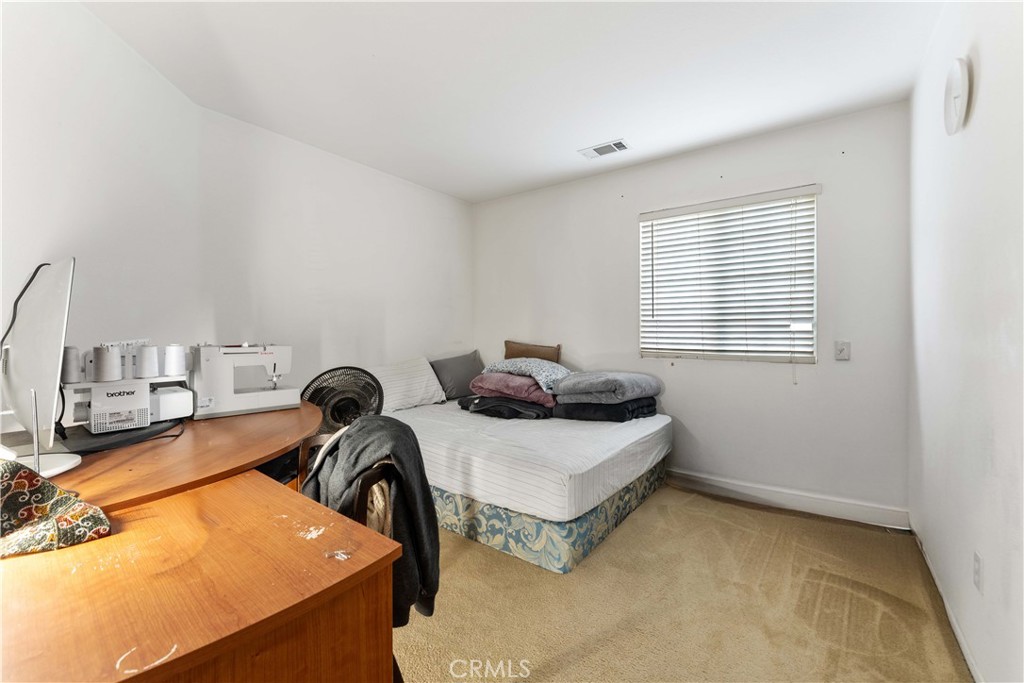 11390 Parkfield Court Riverside, CA 92505 - Photo 25 of 42 a room with two chairs and a table