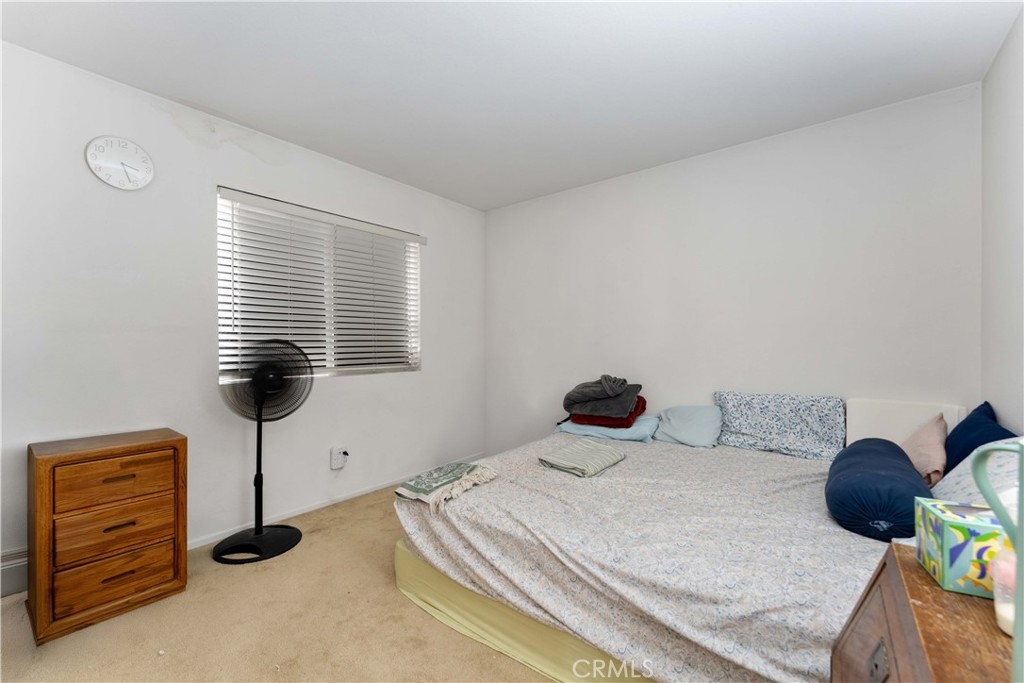 11390 Parkfield Court Riverside, CA 92505 - Photo 26 of 42 a bedroom with a bed and a window