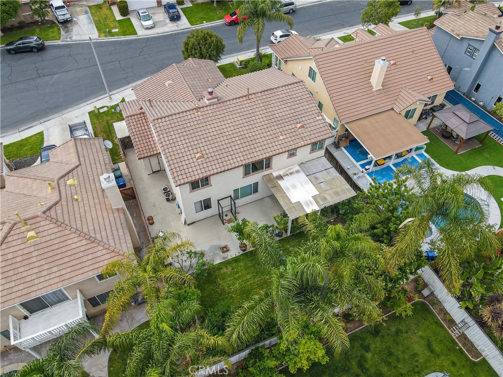 11390 Parkfield Court Riverside, CA 92505 - Photo 4 of 42 an aerial view of multiple houses with yard