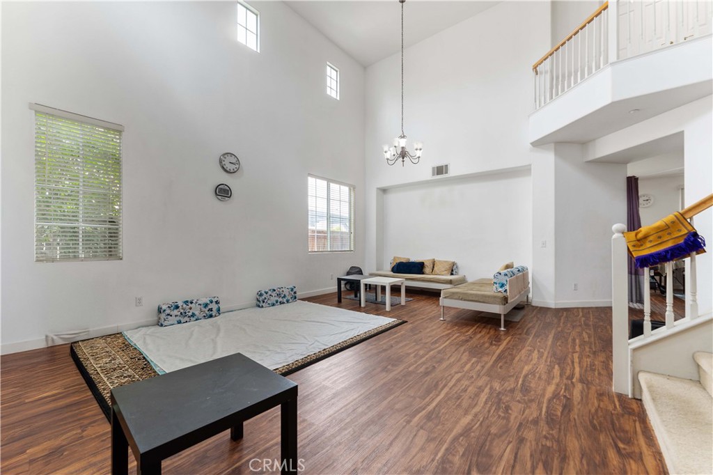 11390 Parkfield Court Riverside, CA 92505 - Photo 6 of 42 a living room with furniture and a wooden floor