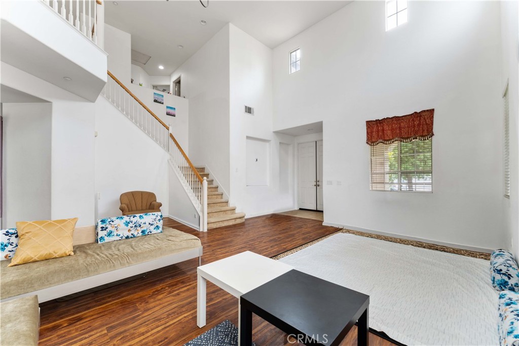 11390 Parkfield Court Riverside, CA 92505 - Photo 8 of 42 a workspace with furniture and wooden floor