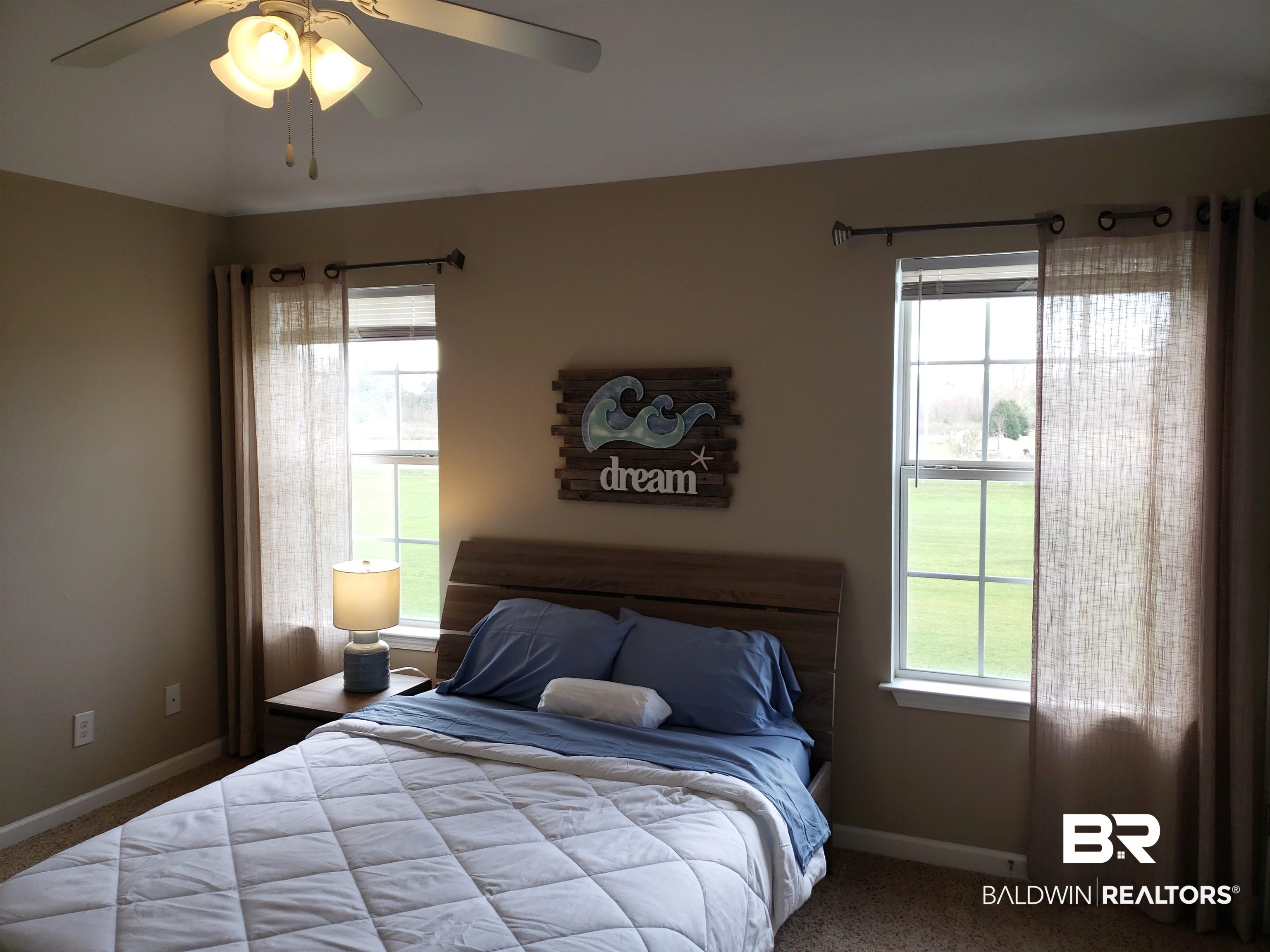 2006 Shelene Way, Unit 2006 Foley, AL 36535 - Photo 8 of 29 Carpeted bedroom featuring baseboards and ceiling fan