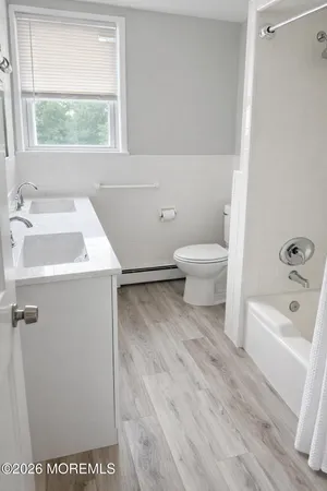 a bathroom with a sink toilet and bathtub