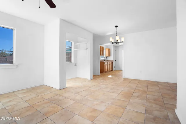 a view of a hallway with a chandelier and chandelier
