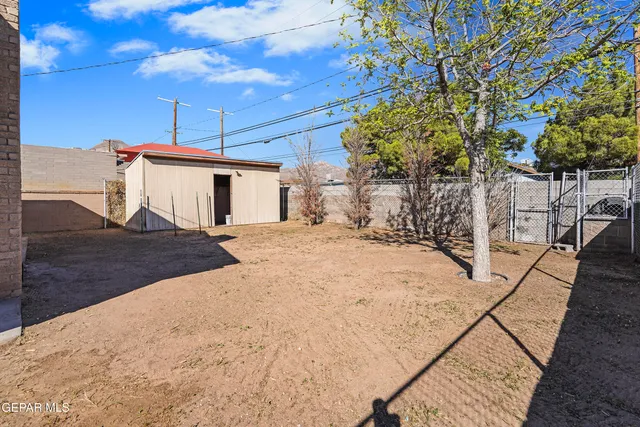 a view of a backyard of the house
