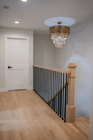 a view of a hallway with a chandelier