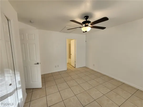 a view of a chandelier fan and closet in a room
