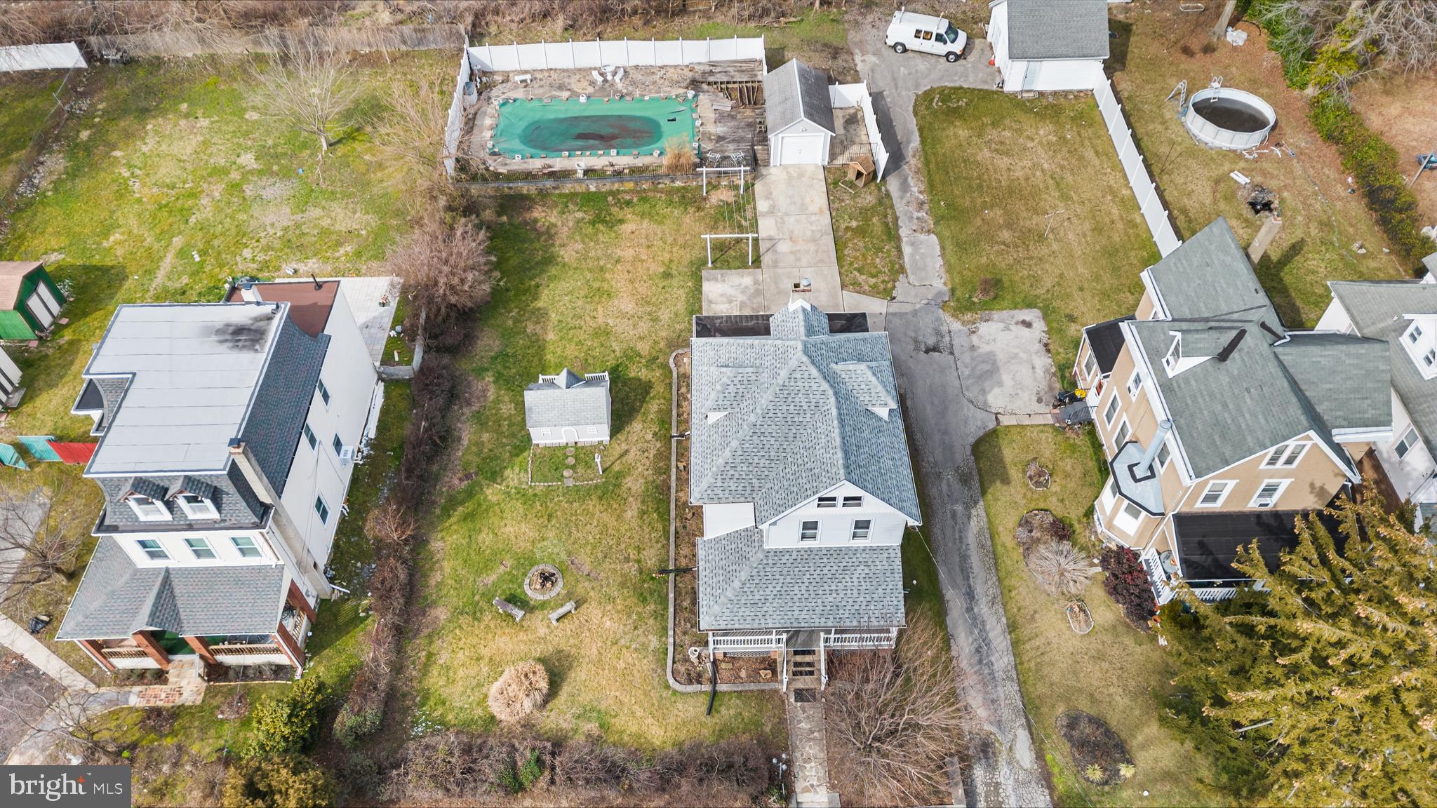 an aerial view of residential house with outdoor space and parking