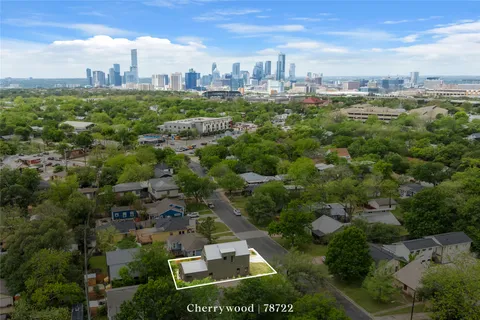 an aerial view of residential building with city view