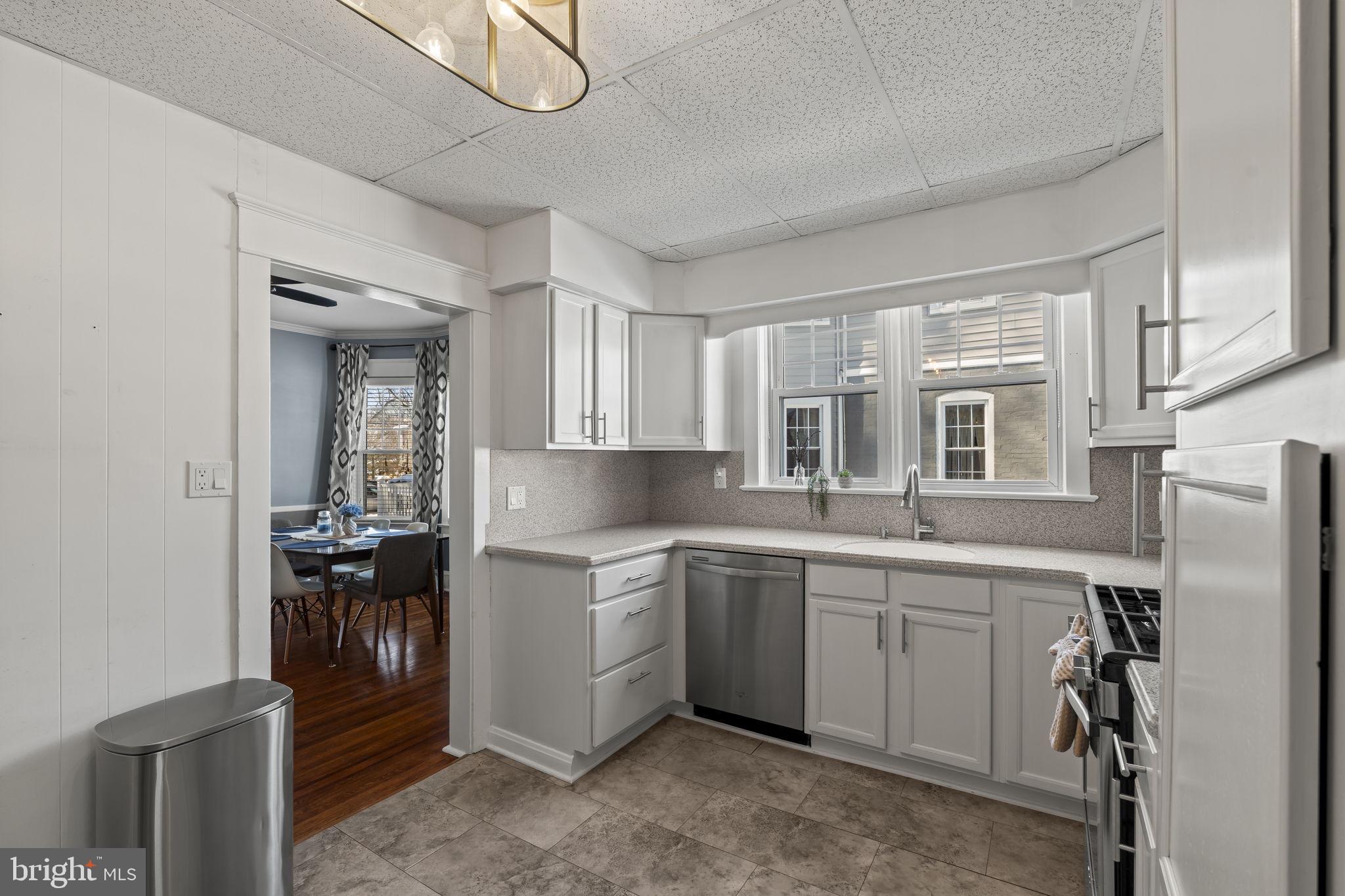 237 7th Avenue Haddon Heights, NJ 08035 - Photo 13 of 35 a kitchen with a sink stainless steel appliances cabinets and furniture