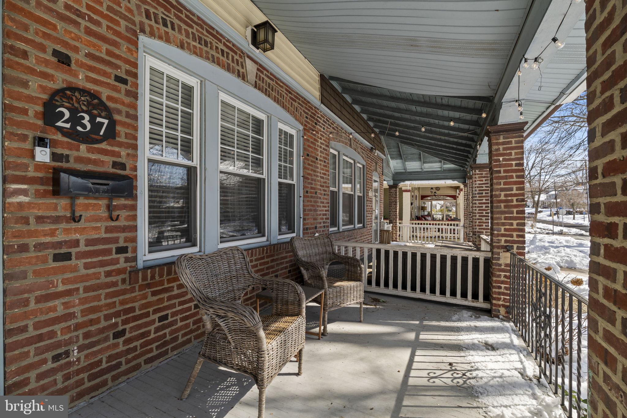 237 7th Avenue Haddon Heights, NJ 08035 - Photo 5 of 35 a view of a porch with a table and chairs