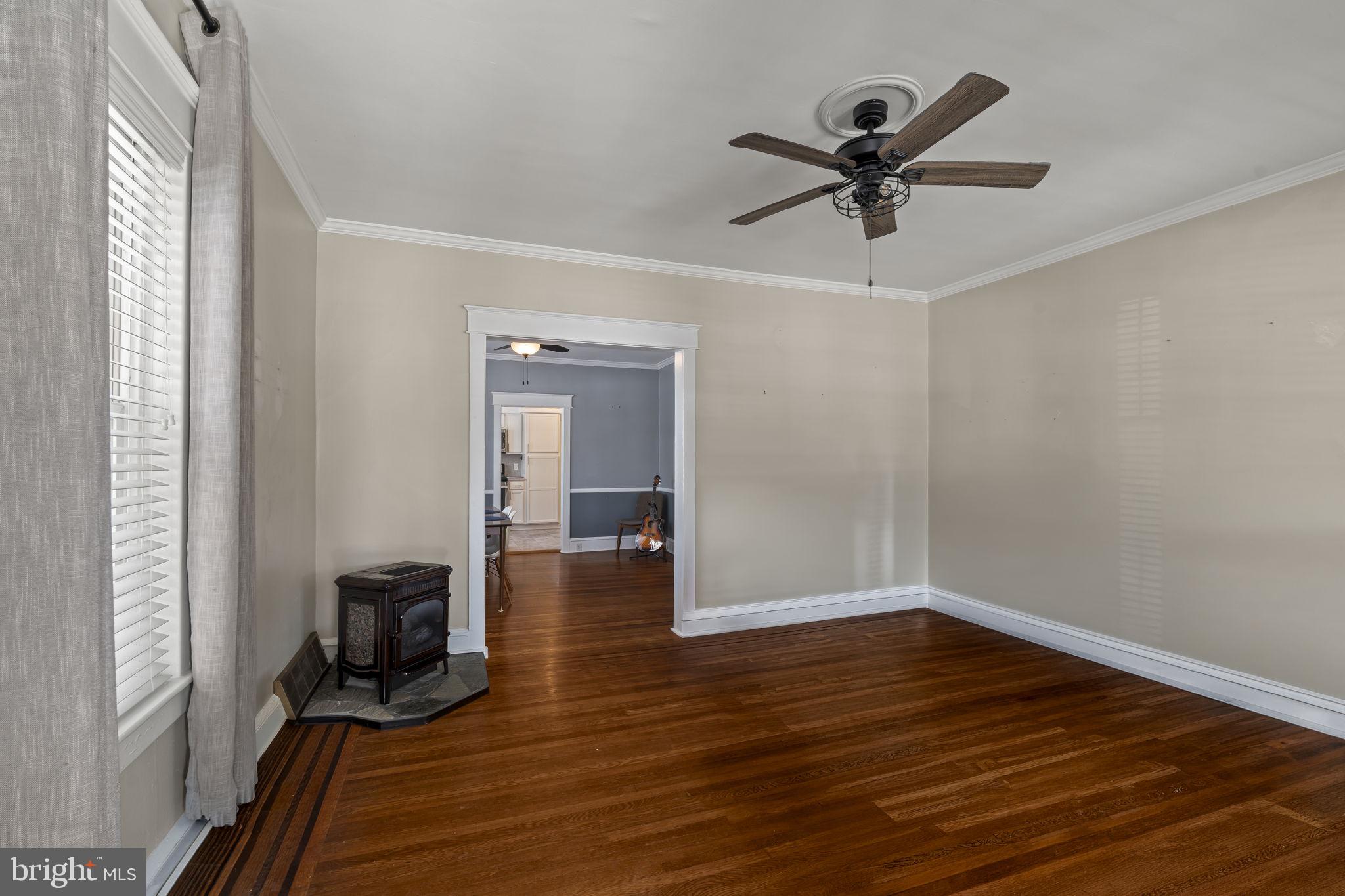 237 7th Avenue Haddon Heights, NJ 08035 - Photo 6 of 35 a view of a livingroom with wooden floor and a ceiling fan