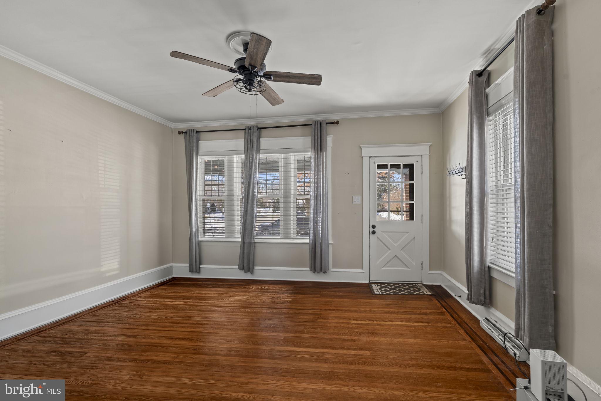 237 7th Avenue Haddon Heights, NJ 08035 - Photo 7 of 35 a view of an empty room with window and wooden floor