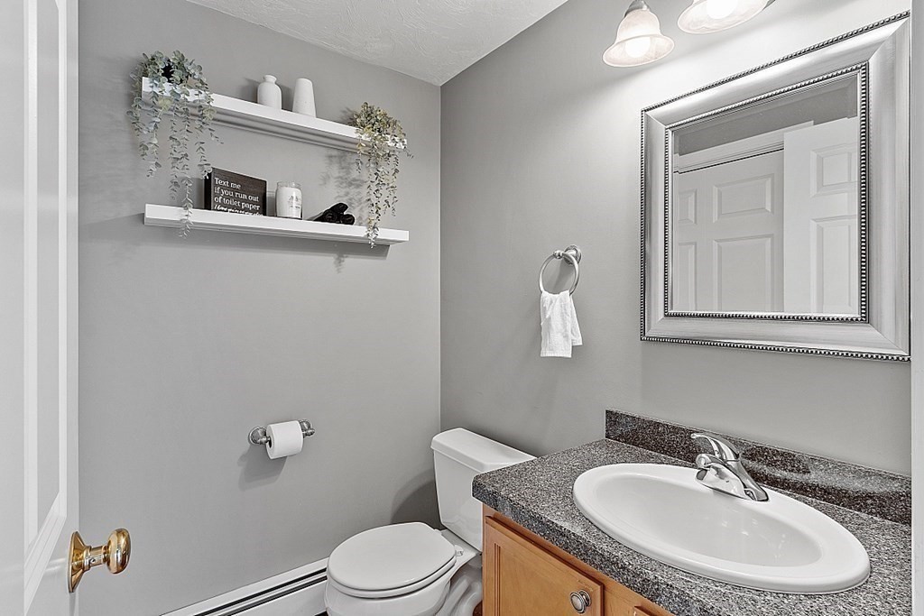 3 William Circle Rutland, MA 01543 - Photo 18 of 42 a bathroom with a toilet sink and mirror