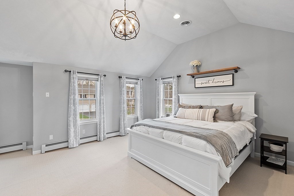 3 William Circle Rutland, MA 01543 - Photo 22 of 42 a spacious bedroom with a bed and a large window