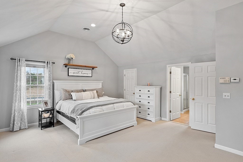 3 William Circle Rutland, MA 01543 - Photo 24 of 42 a spacious bedroom with a bed and a window