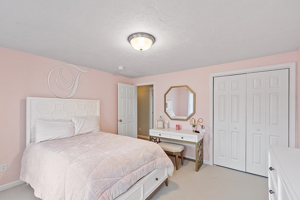 3 William Circle Rutland, MA 01543 - Photo 26 of 42 a bedroom with a bed a mirror and a window