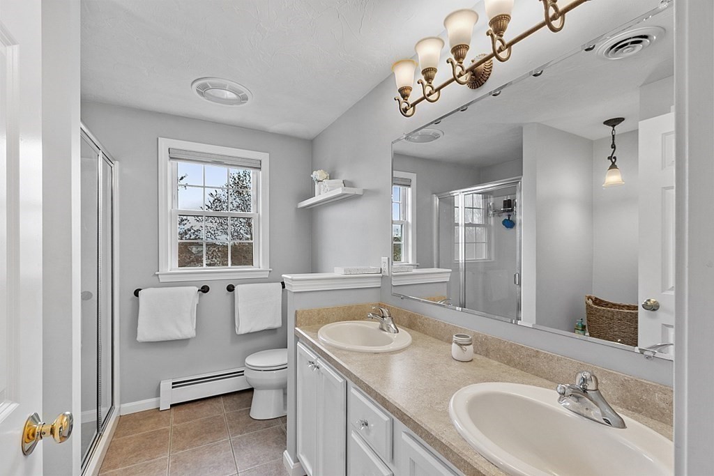 3 William Circle Rutland, MA 01543 - Photo 27 of 42 a bathroom with a sink a toilet and mirror