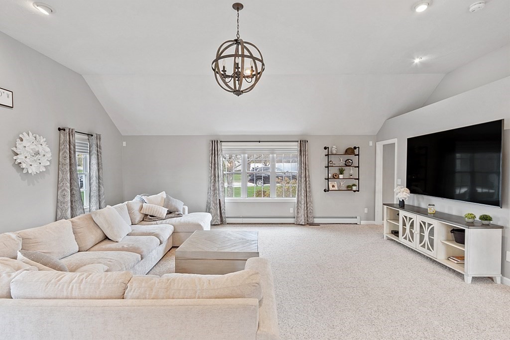 3 William Circle Rutland, MA 01543 - Photo 9 of 42 a living room with furniture and a flat screen tv