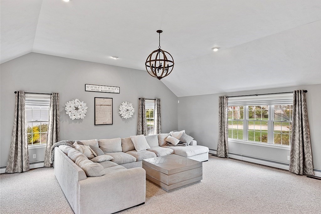 3 William Circle Rutland, MA 01543 - Photo 10 of 42 a living room with furniture chandelier and a window