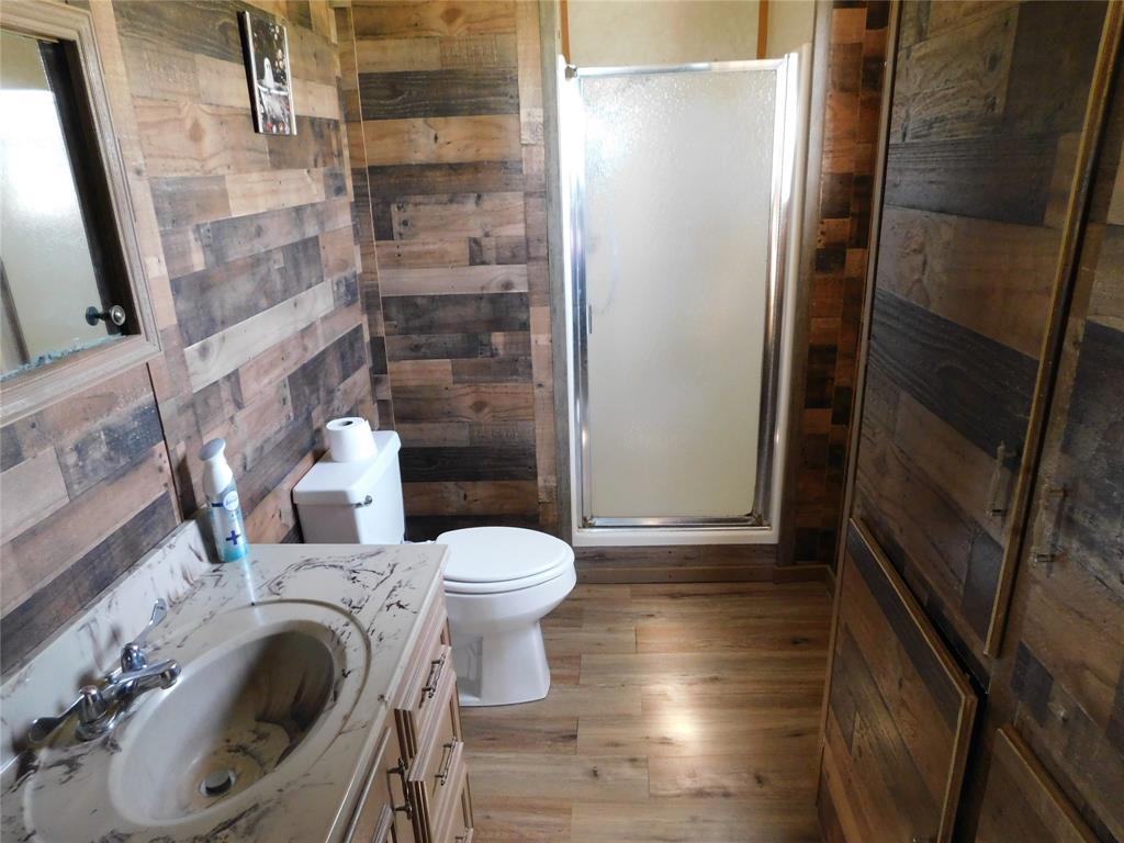5401 Highway 36 Comanche, TX 76442 - Photo 12 of 22 a bathroom with a toilet and a shower