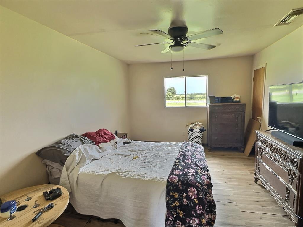 5401 Highway 36 Comanche, TX 76442 - Photo 15 of 22 a bedroom with a bed and a flat screen tv