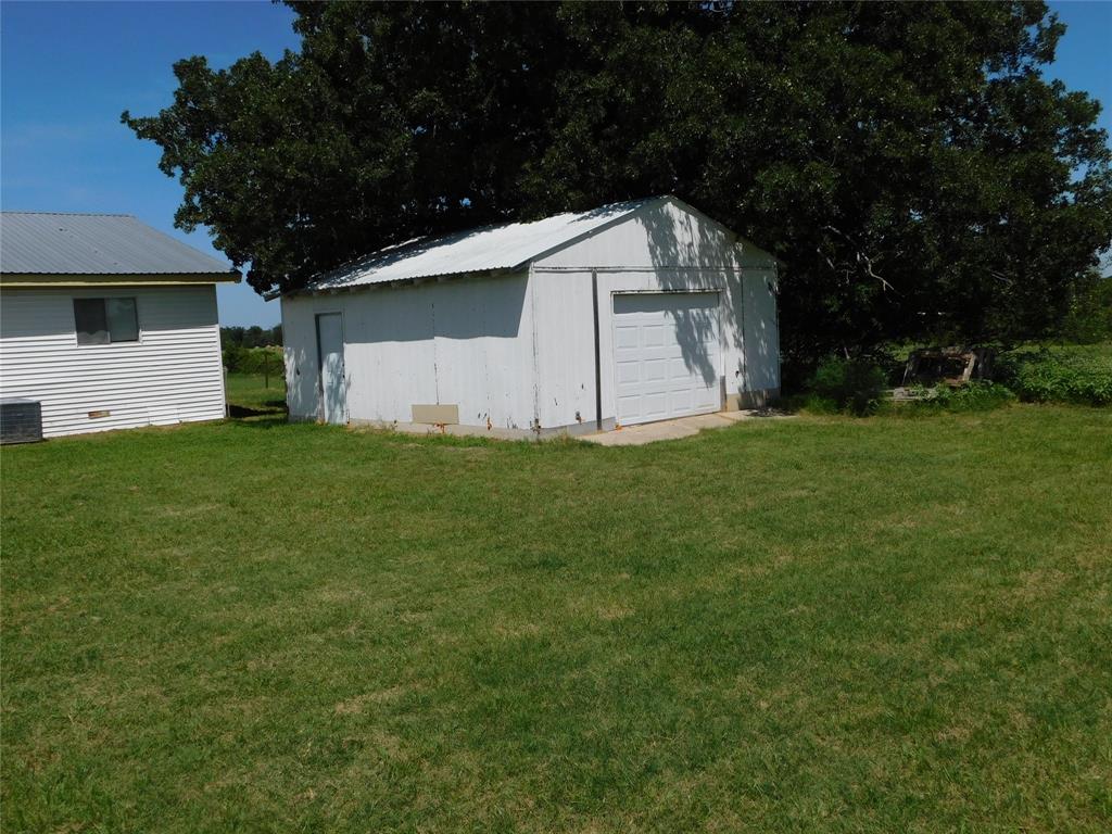 5401 Highway 36 Comanche, TX 76442 - Photo 19 of 22 a white house that has a tree in front of it
