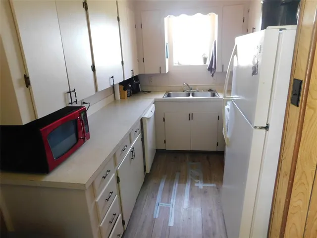 a bathroom with a sink a mirror and a shower