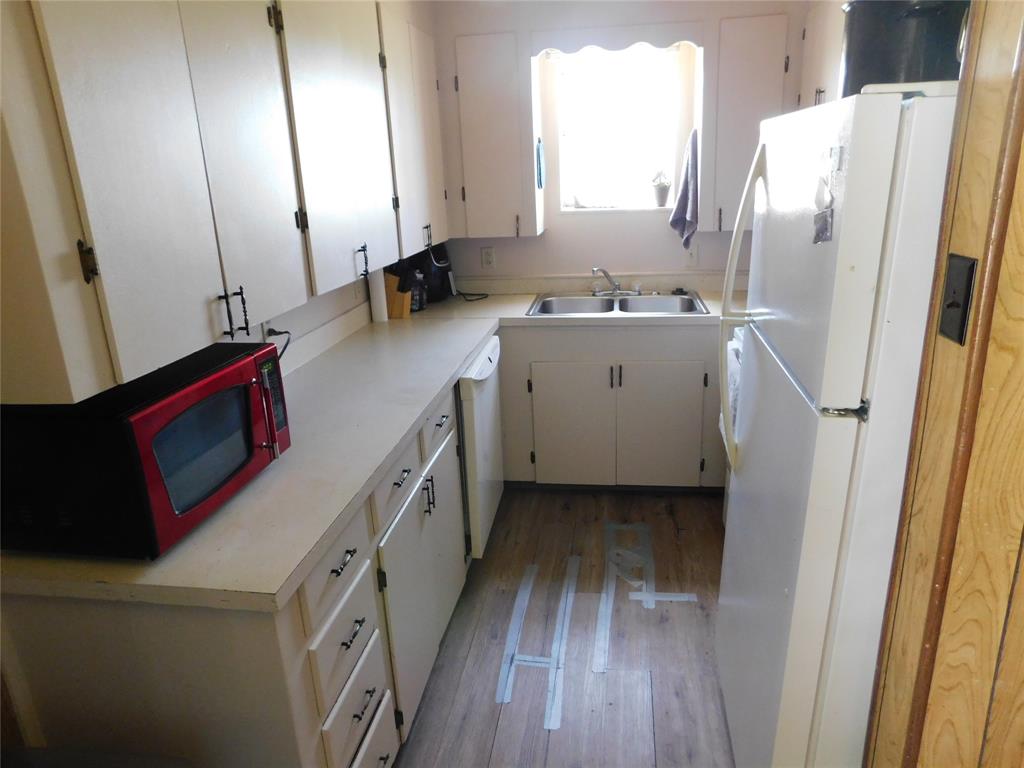 5401 Highway 36 Comanche, TX 76442 - Photo 8 of 22 a bathroom with a sink a mirror and a shower