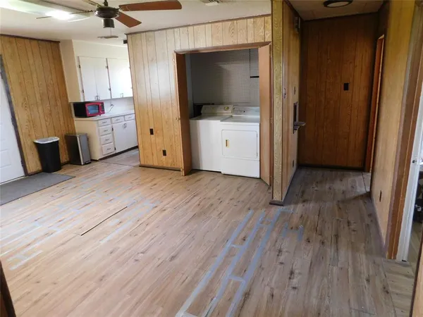 wooden floor in an empty room with a fireplace
