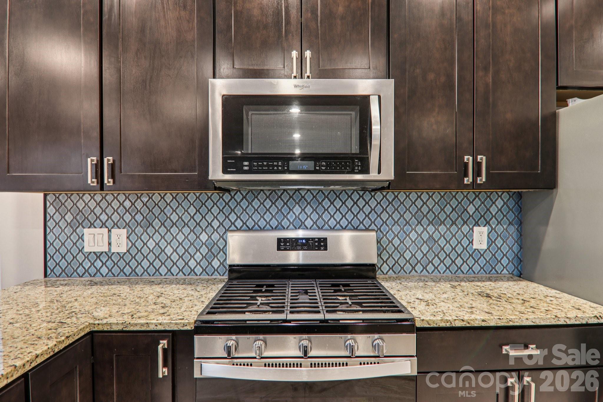 29 Saddle Top Road Flat Rock, NC 28731 - Photo 21 of 46 a stove top oven sitting inside of a kitchen