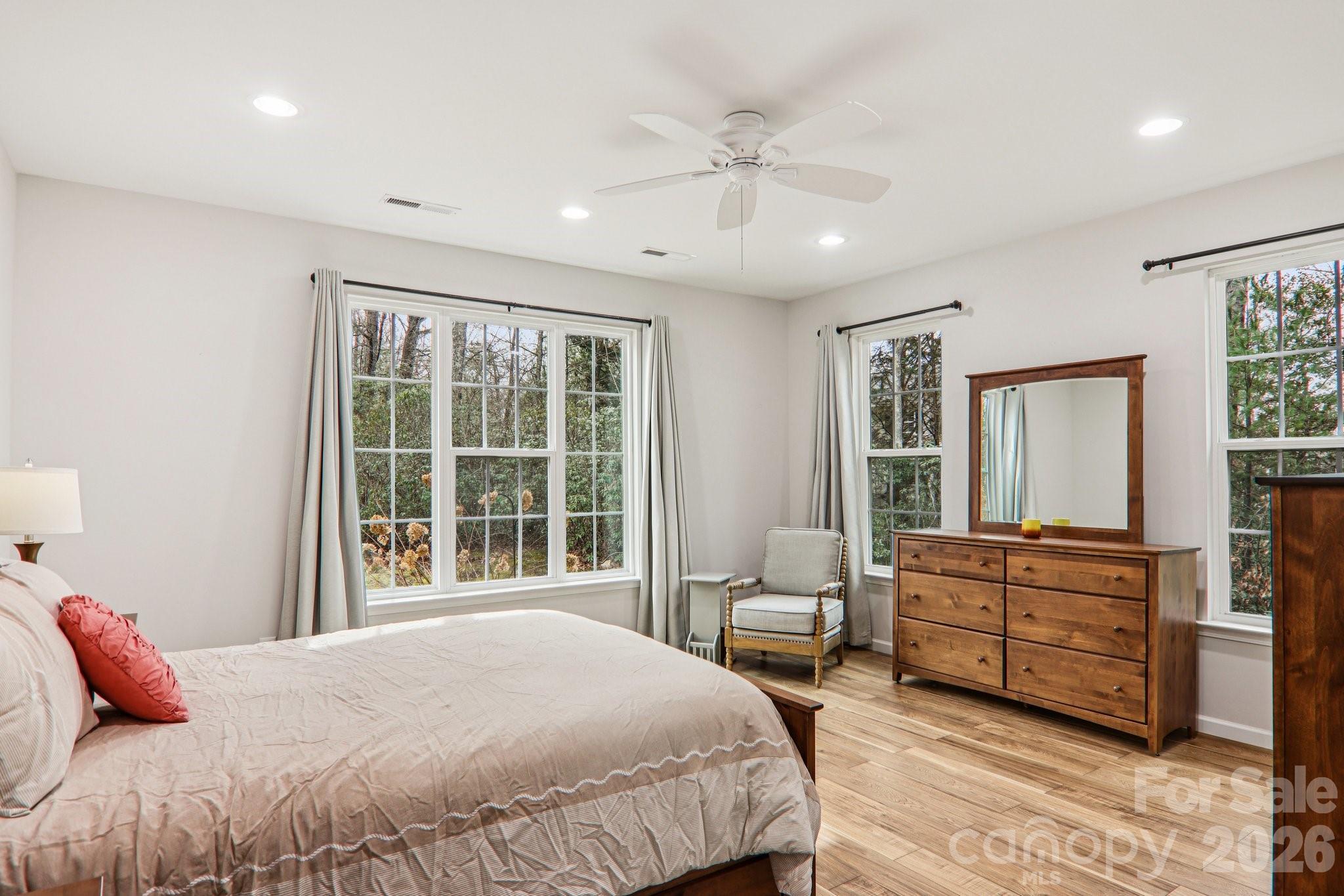 29 Saddle Top Road Flat Rock, NC 28731 - Photo 23 of 46 a bedroom with a bed dresser and a large window