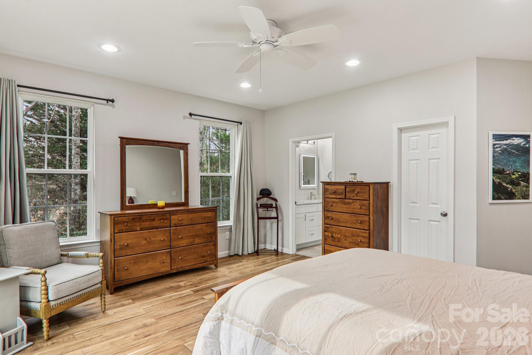 29 Saddle Top Road Flat Rock, NC 28731 - Photo 24 of 46 a bedroom with a bed dresser and a flat tv screen