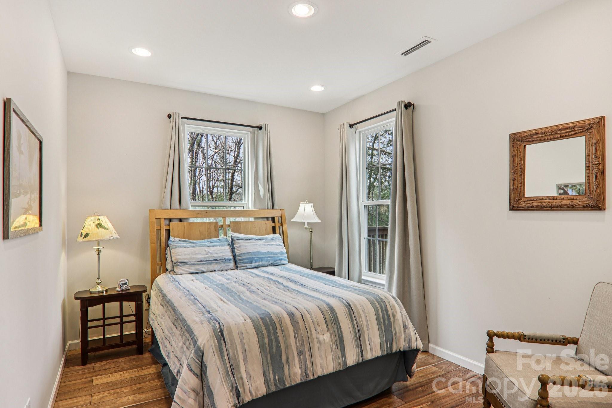 29 Saddle Top Road Flat Rock, NC 28731 - Photo 29 of 46 a bedroom with a large bed and a lamp