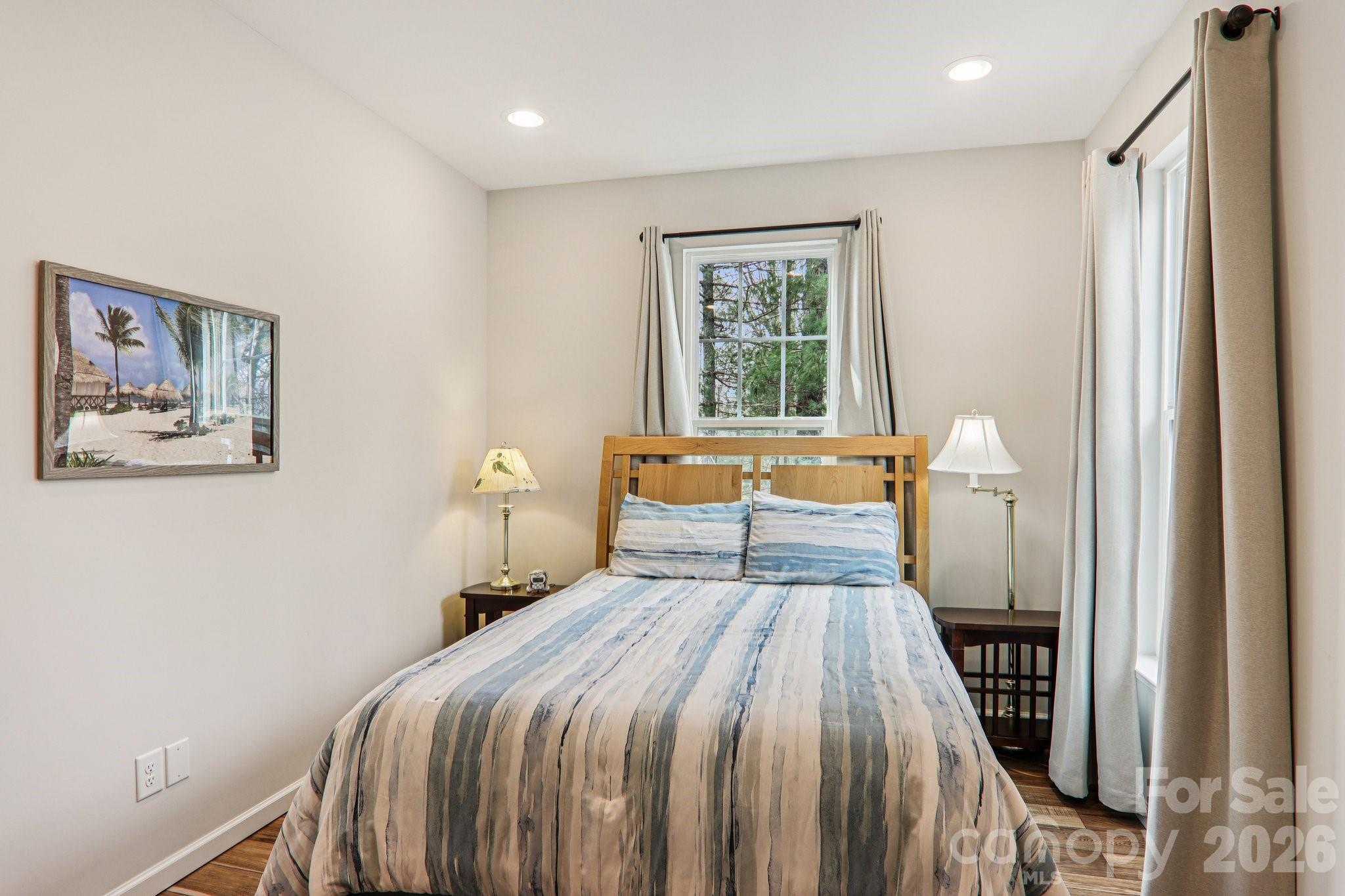 29 Saddle Top Road Flat Rock, NC 28731 - Photo 30 of 46 a bedroom with a bed and a window