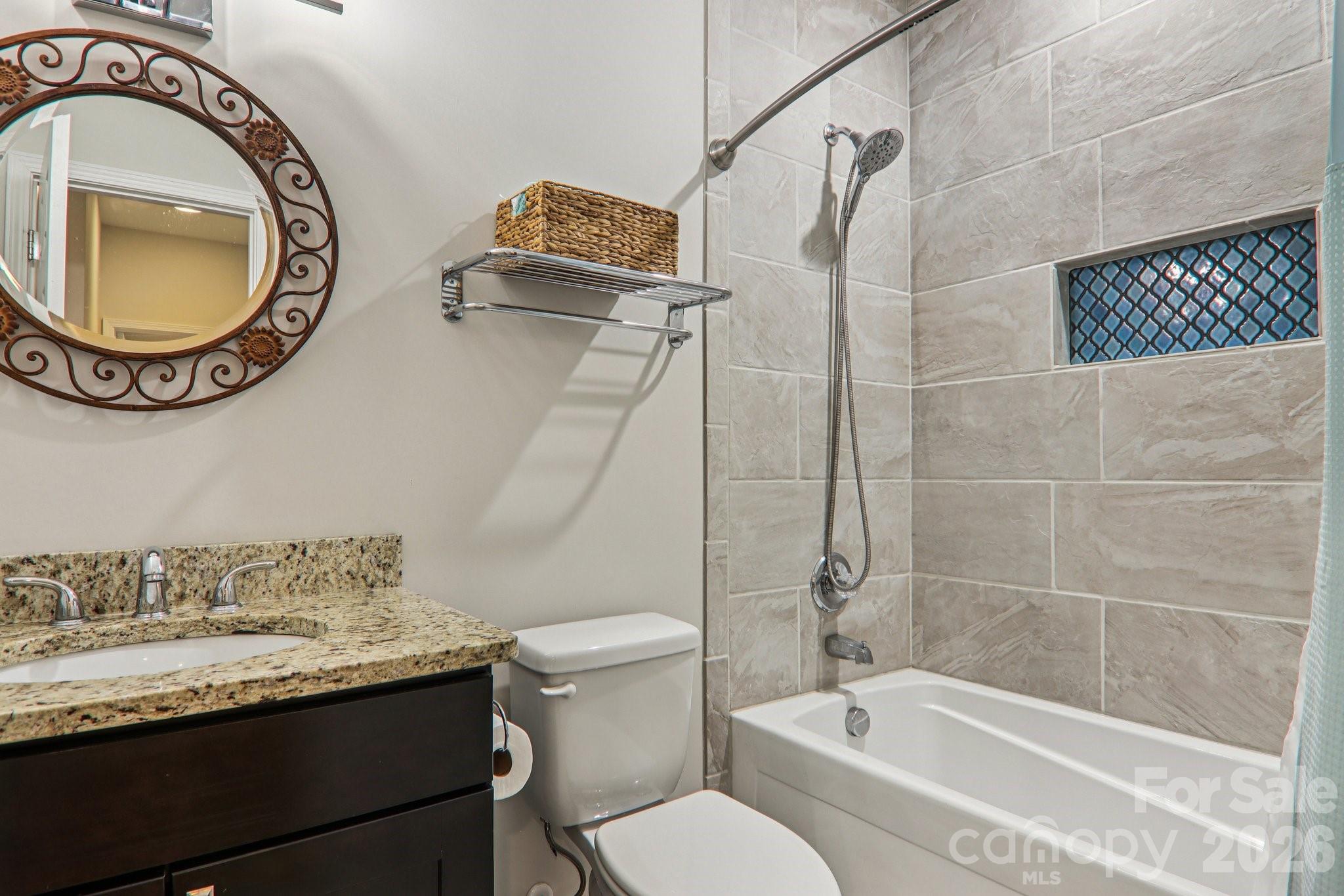 29 Saddle Top Road Flat Rock, NC 28731 - Photo 31 of 46 a bathroom with a granite countertop sink and a mirror
