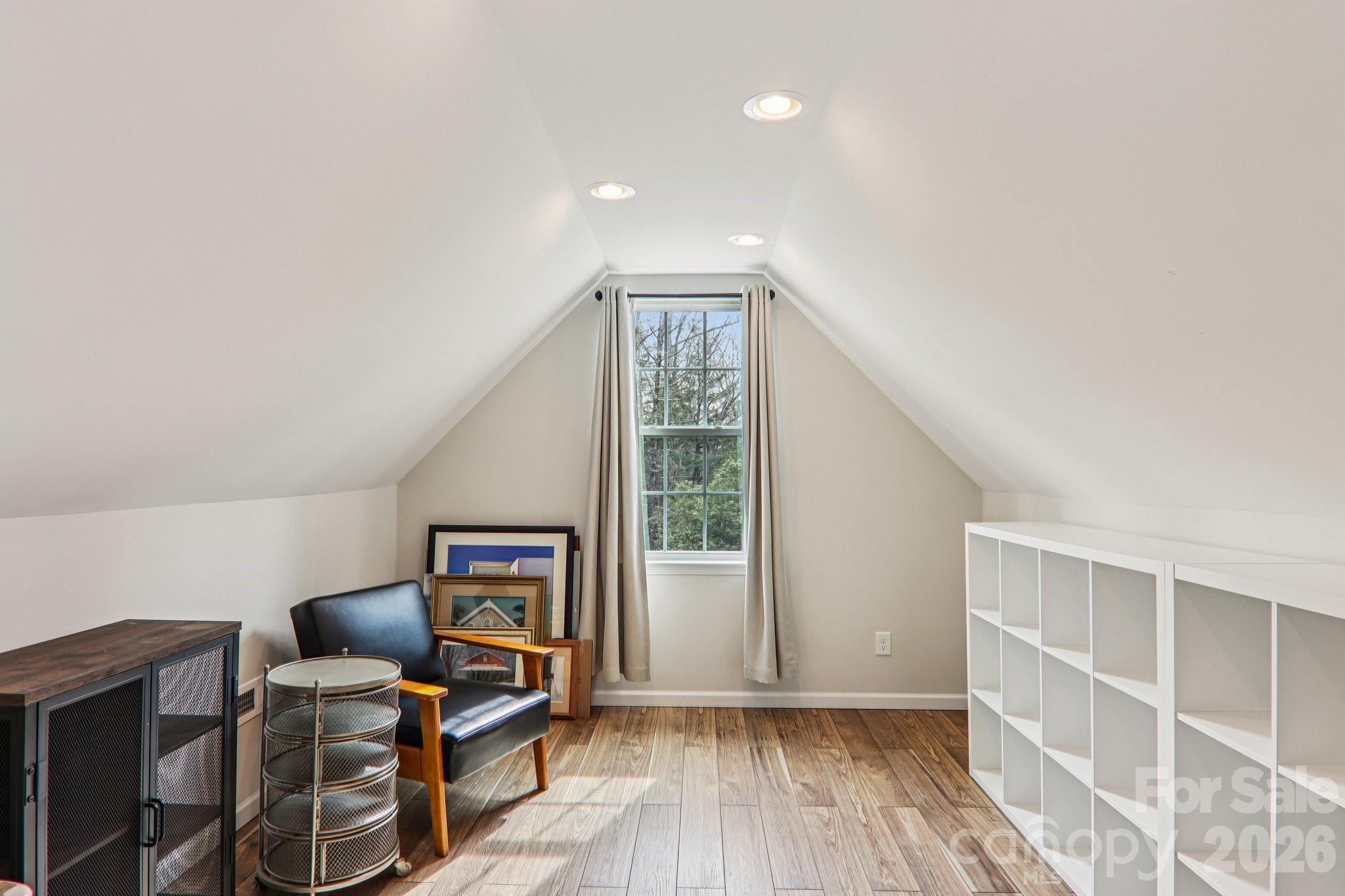 29 Saddle Top Road Flat Rock, NC 28731 - Photo 32 of 46 a view of an empty room with wooden floor and furniture