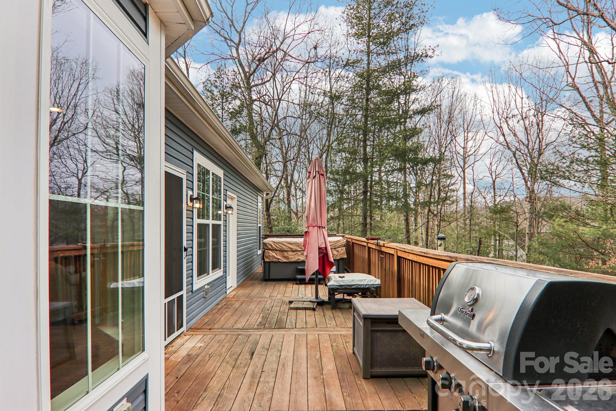 29 Saddle Top Road Flat Rock, NC 28731 - Photo 34 of 46 a view of a patio with couches chairs and wooden floor