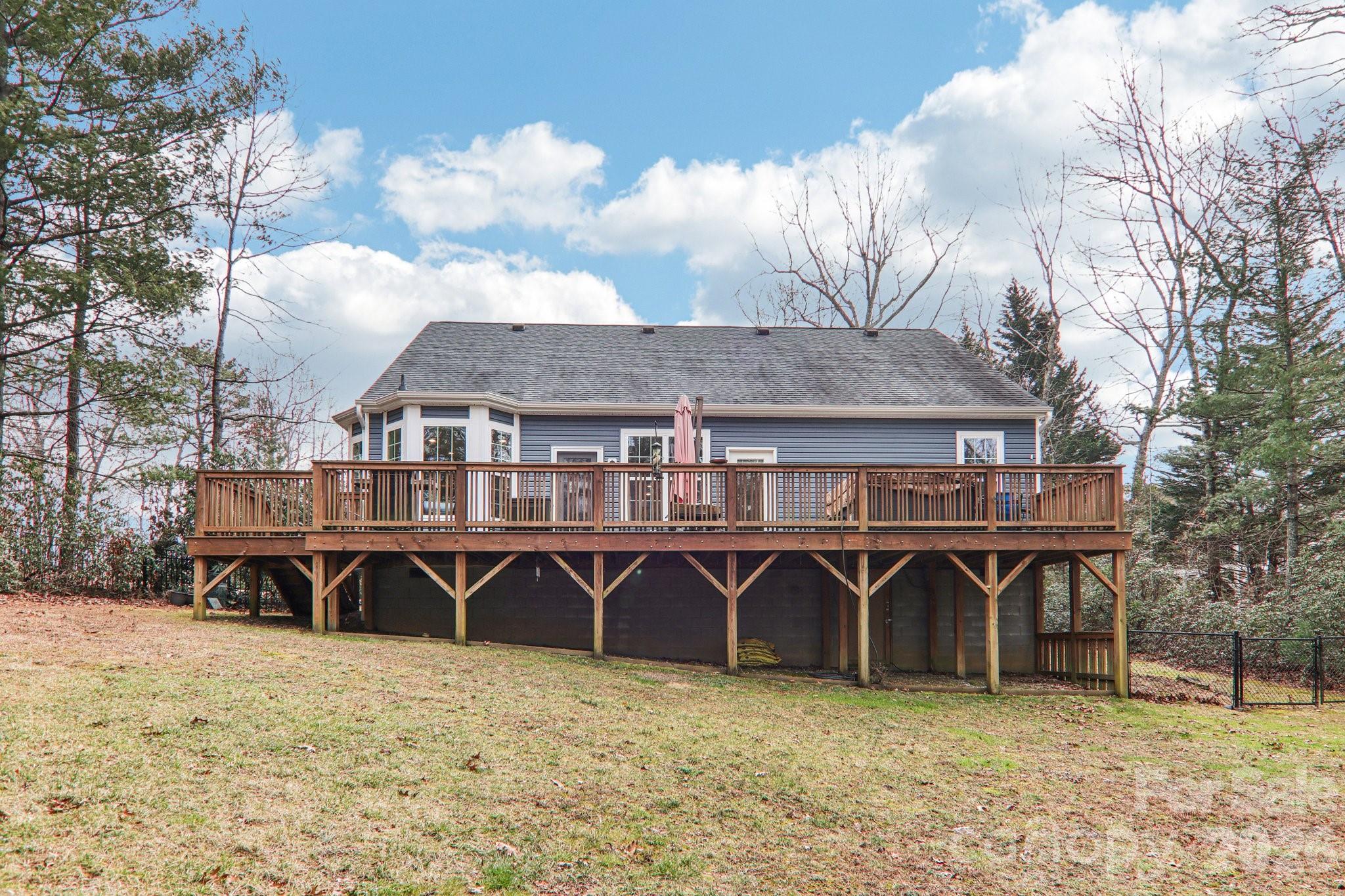 29 Saddle Top Road Flat Rock, NC 28731 - Photo 35 of 46 a front view of a house with yard and trees