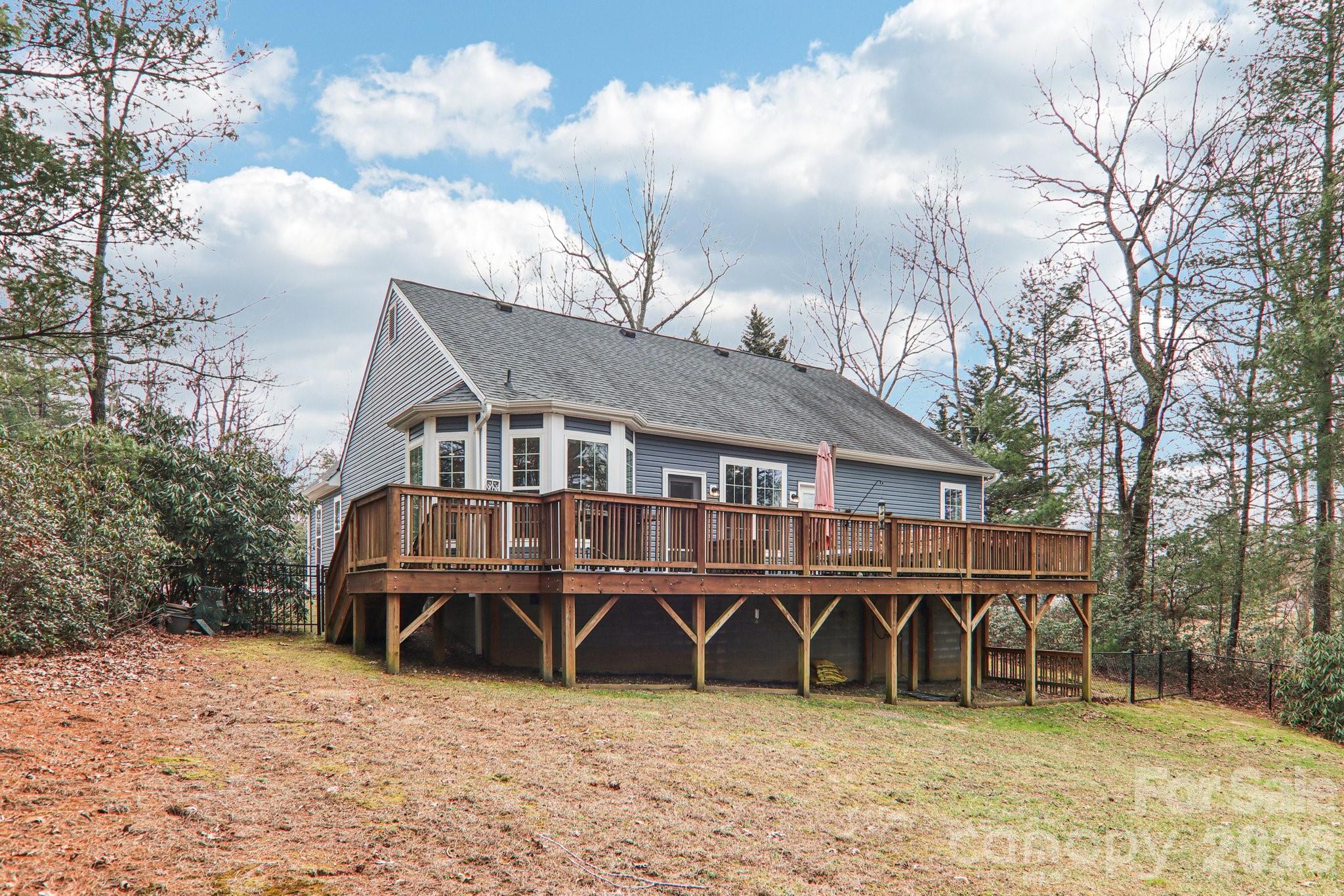 29 Saddle Top Road Flat Rock, NC 28731 - Photo 36 of 46 a view of a house with wooden fence