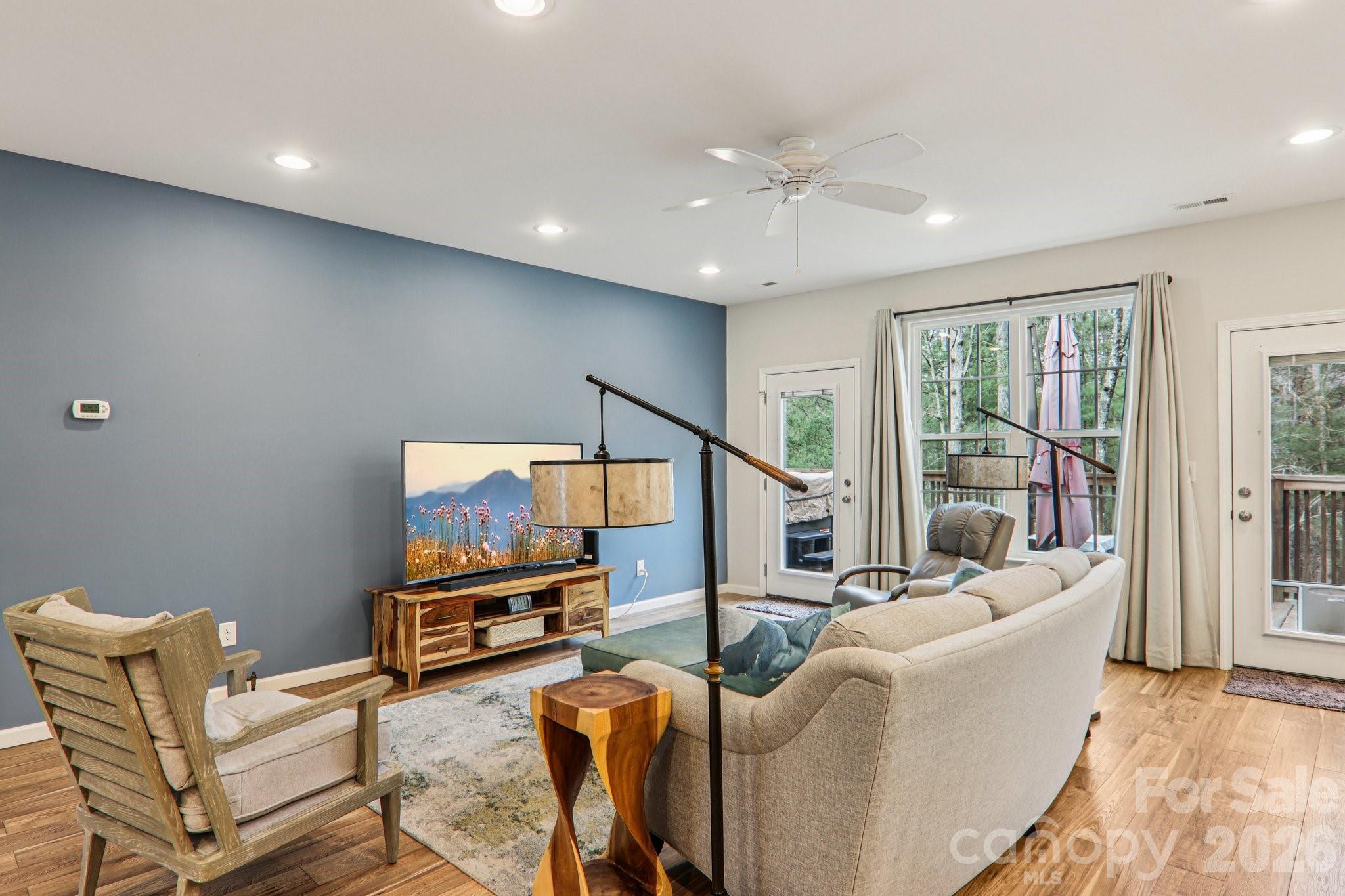 29 Saddle Top Road Flat Rock, NC 28731 - Photo 4 of 46 a living room with furniture and a flat screen tv