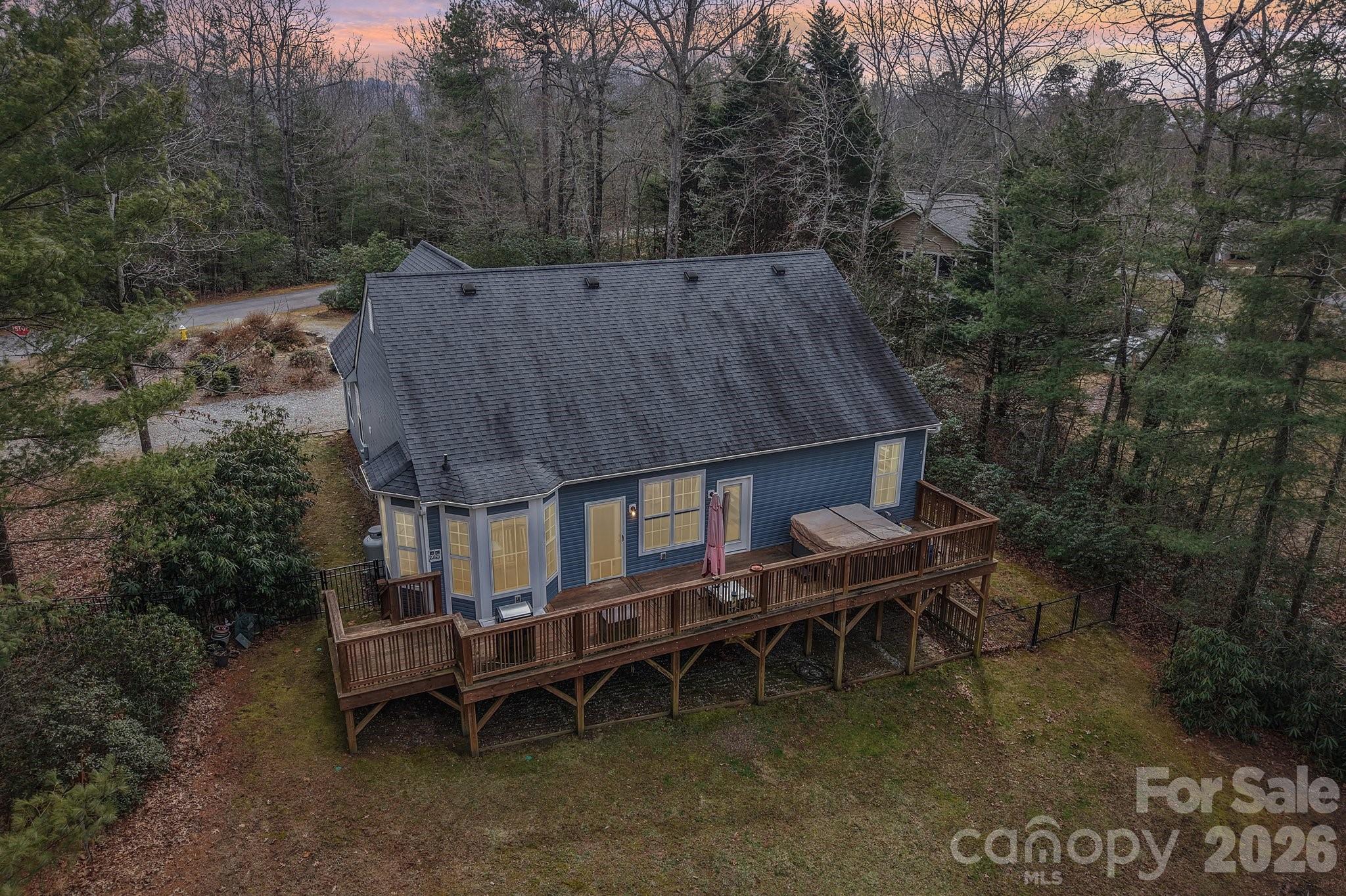 29 Saddle Top Road Flat Rock, NC 28731 - Photo 45 of 46 a backyard of a house with table and chairs