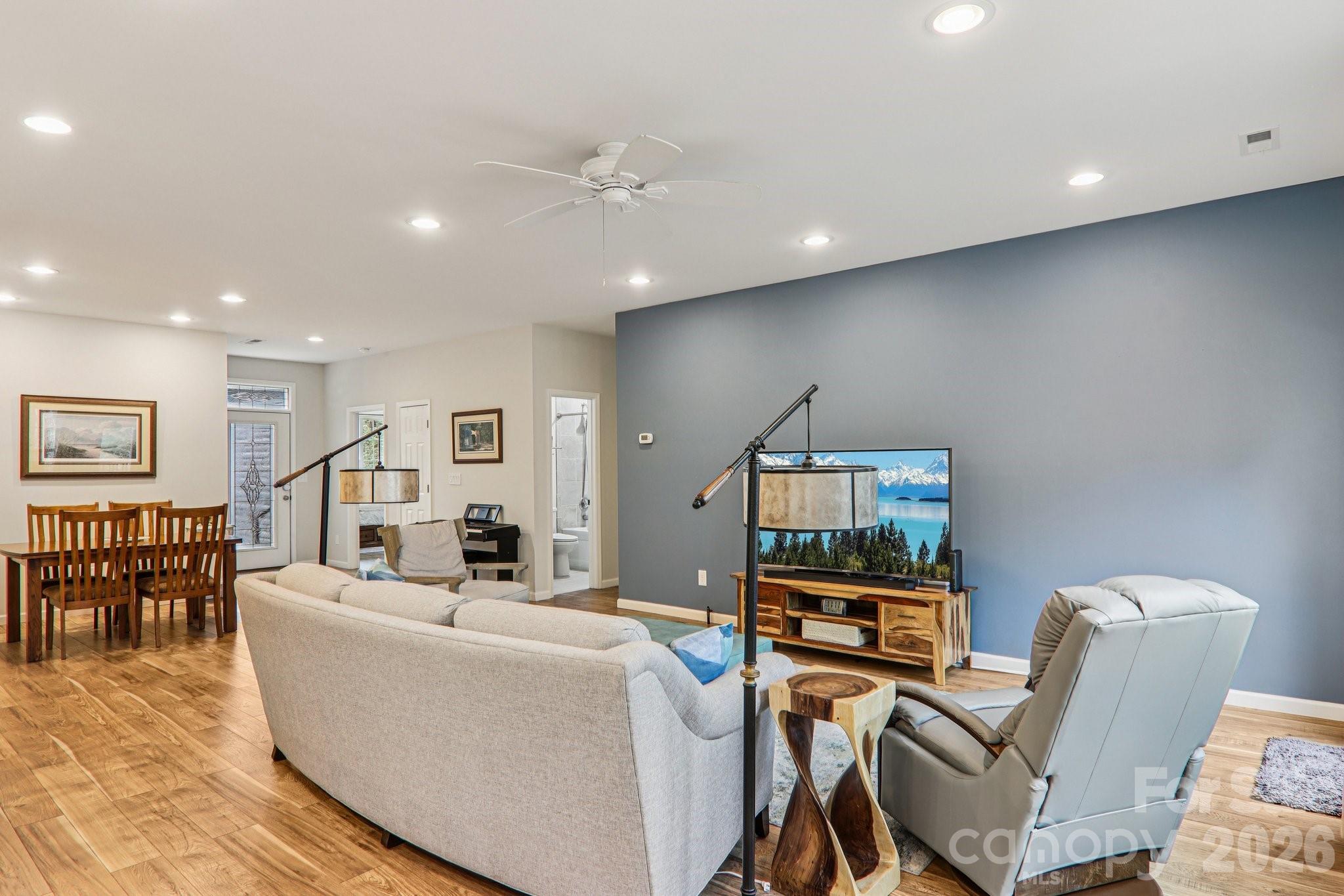29 Saddle Top Road Flat Rock, NC 28731 - Photo 5 of 46 a living room with furniture and a flat screen tv